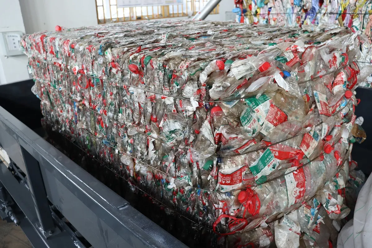 PET bottles with labels and caps before recycling