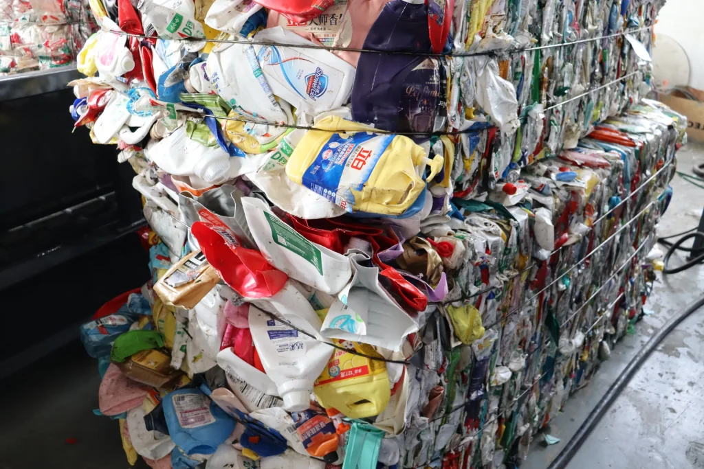 Waste HDPE PP bottles baled before washing