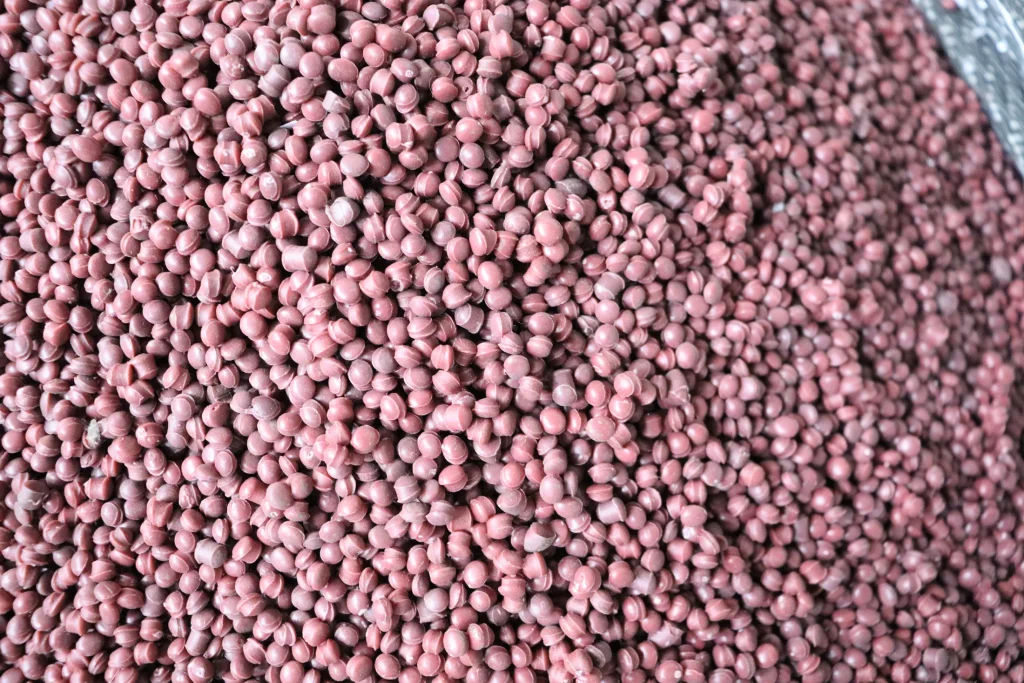 Pink recycled pellets after film pelletizing