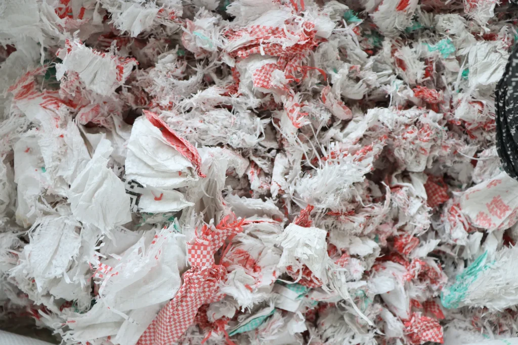 Printed plastic film and PP woven bag scrap before washing and pelletizing