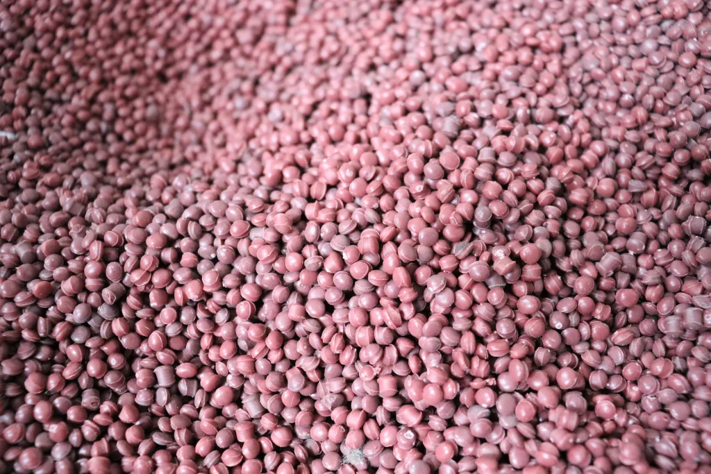 Pink recycled pellets after pelletizing