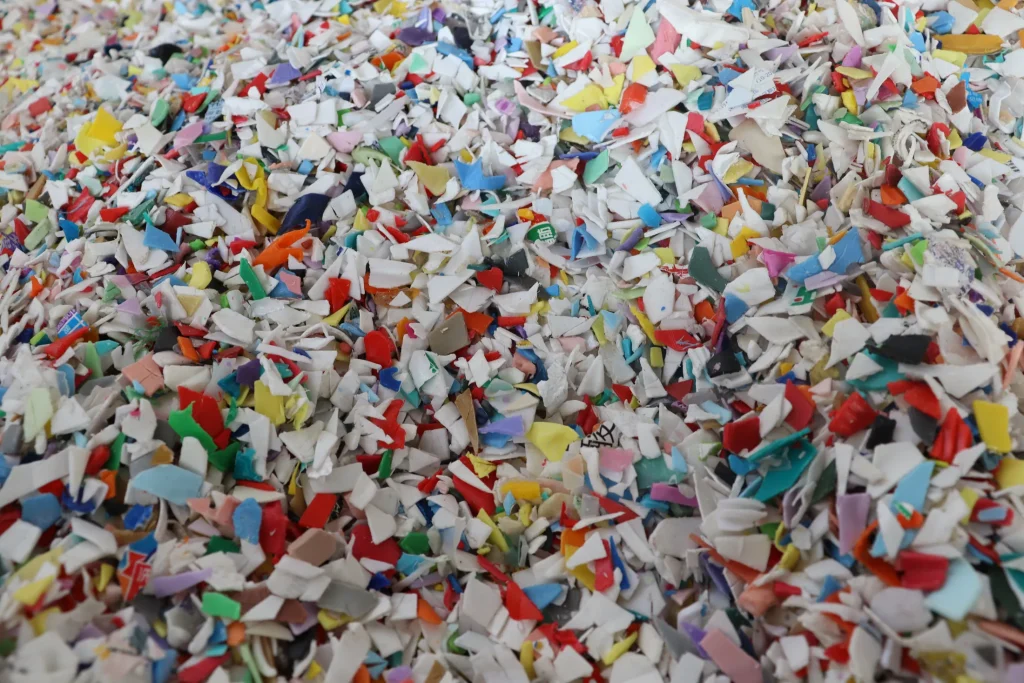 Mixed colour rigid plastic flakes before pelletizing